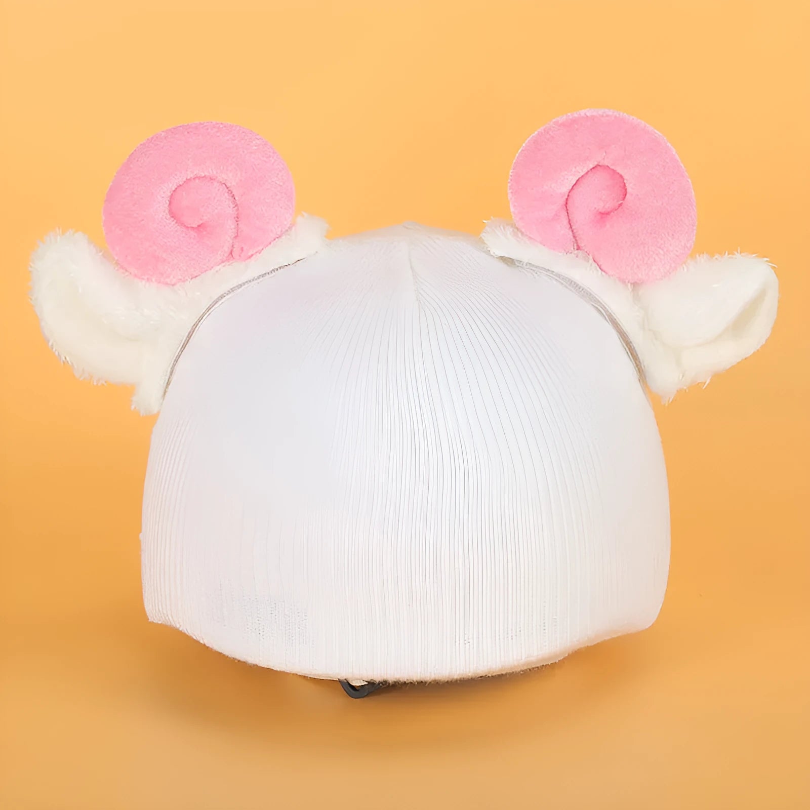 A soft plush cartoon character cover stretched over a medium-sized motorcycle helmet.