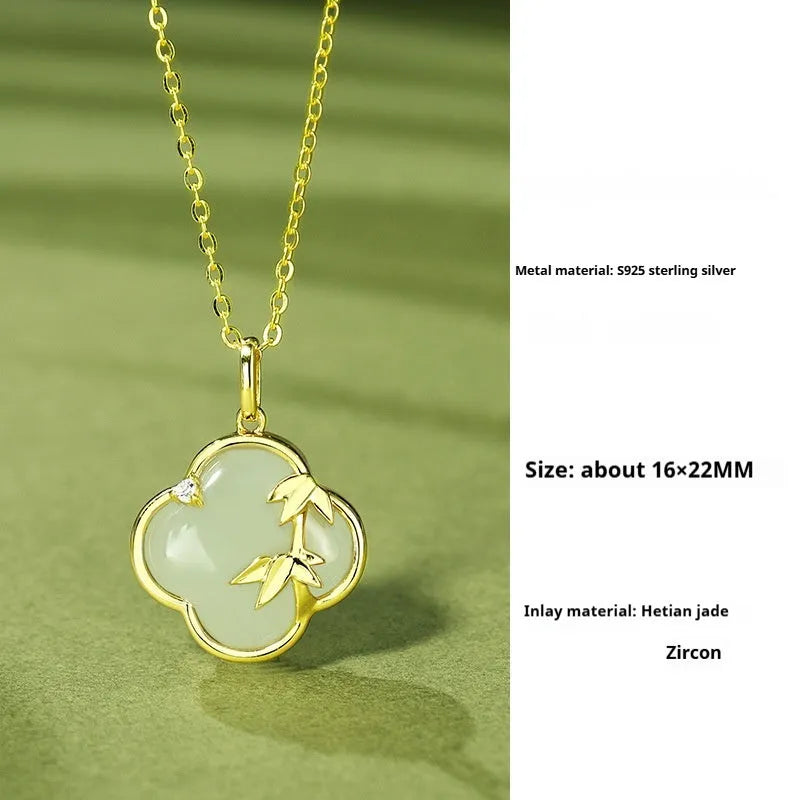 Hetian Jade festival bracelet and necklace set with inlaid jade leaf designs on bamboo newspaper tone background