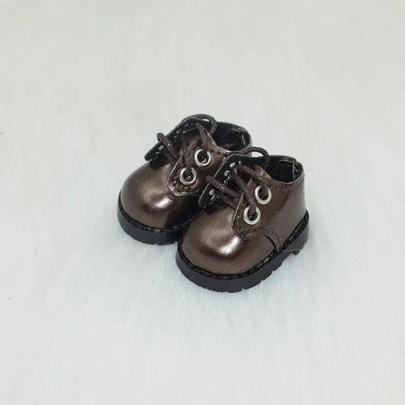 A pair of polyurethane doll shoe accessories for a 17cm figure, shown in a selected style and colour.