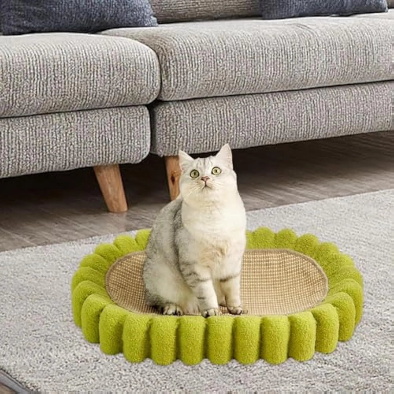 Green oval cat scratch pad bowl with sisal surface measuring 65cm