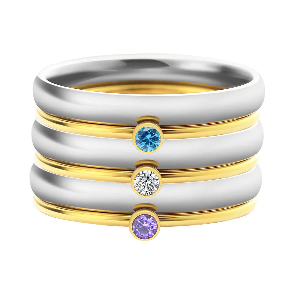 Geometric engraved titanium steel ring with a December three-stone birthstone combination.