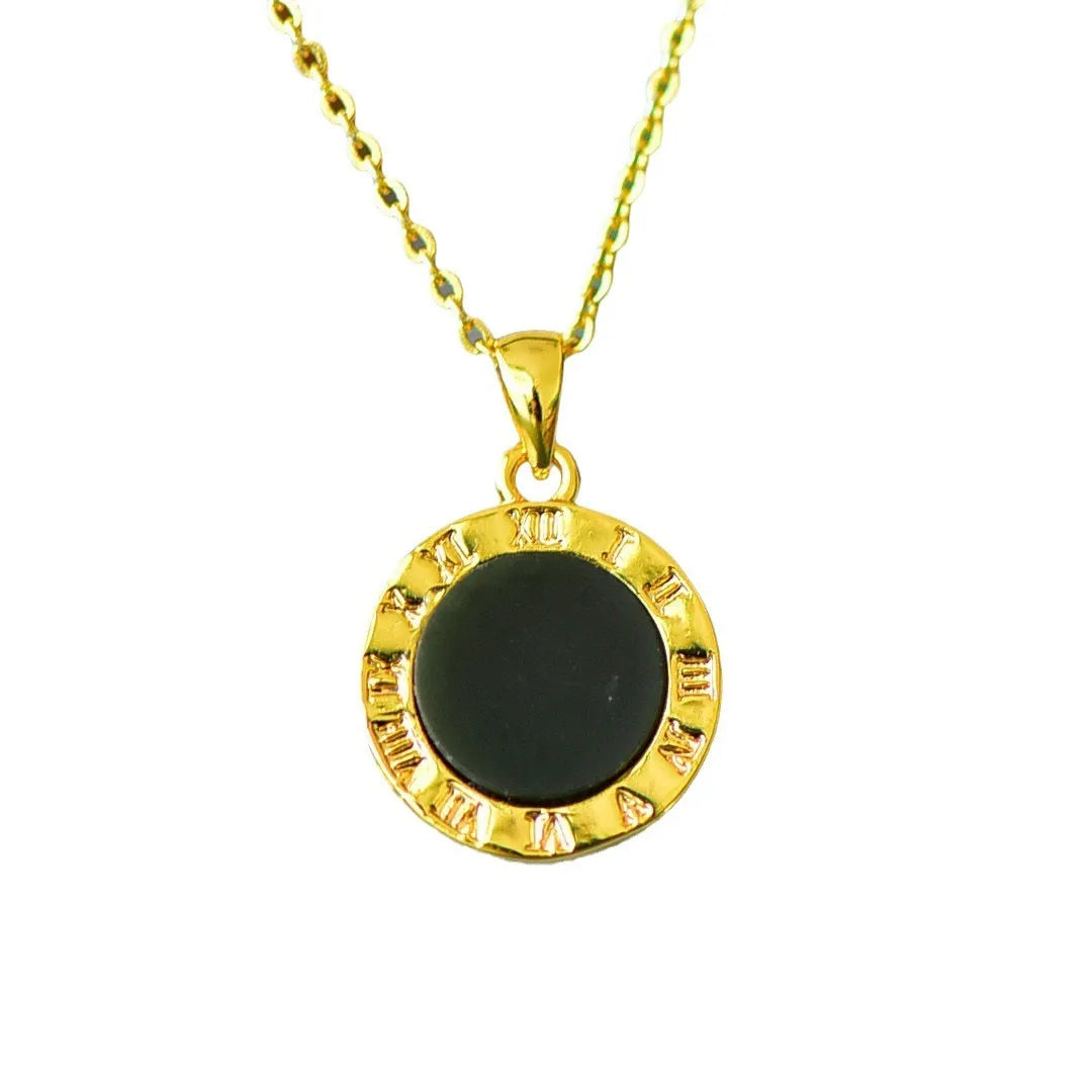 Gray Hetian jade flat pendant with copper inlay on an ink blue cord necklace.