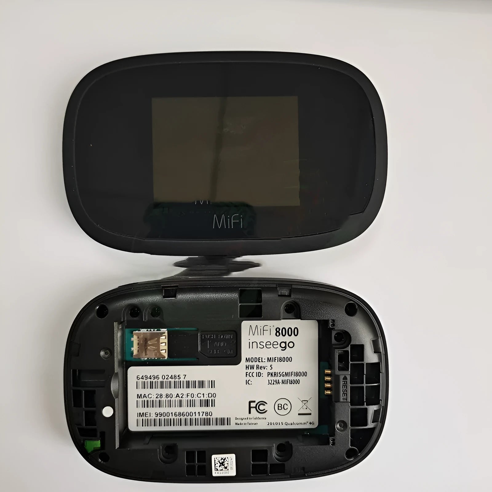 Black portable 4G wireless router with status lights, shown next to a SIM card and USB cable