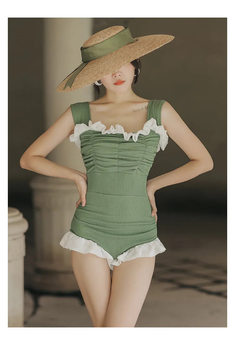 High-waisted one-piece swimsuit in quick-dry polyester fabric, shown in black.