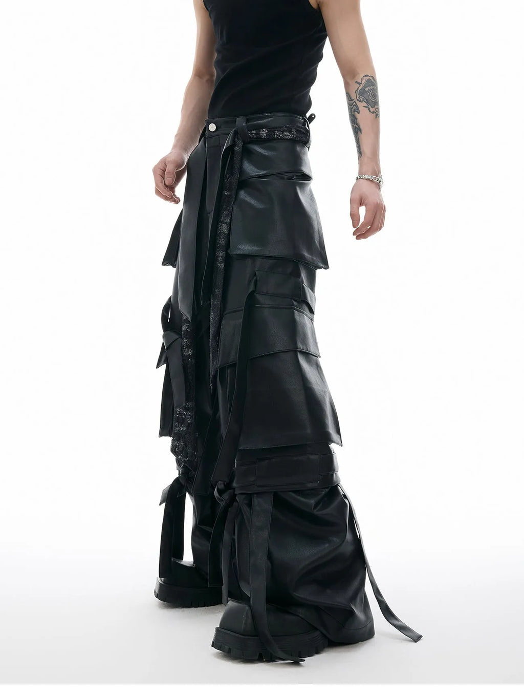Black loose-fit trousers with a quilted pattern and multiple pockets on a mannequin.