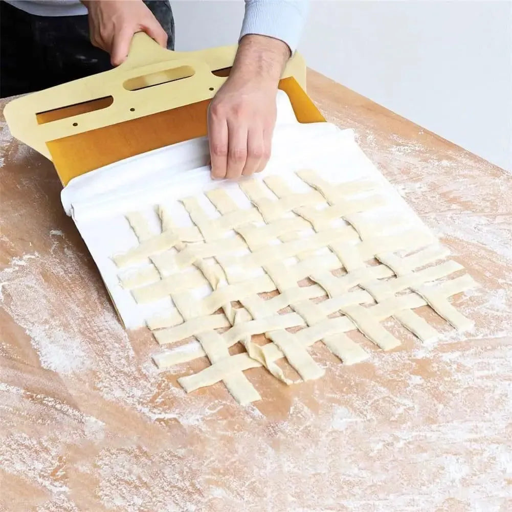 White food-grade PP plastic pizza transfer shovel with a hanging hole, shown on a kitchen counter.