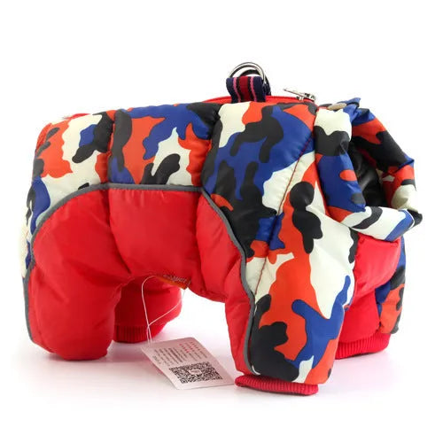 Dog wearing thick cotton winter down jacket in silver colour, standing on sofa