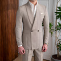 Men's light coffee double-breasted tuxedo suit jacket with notched lapels on a plain background