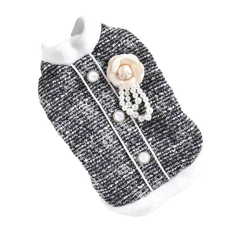 Black PU leather sausage-shaped dog jacket with zip, modelled on a small dog.