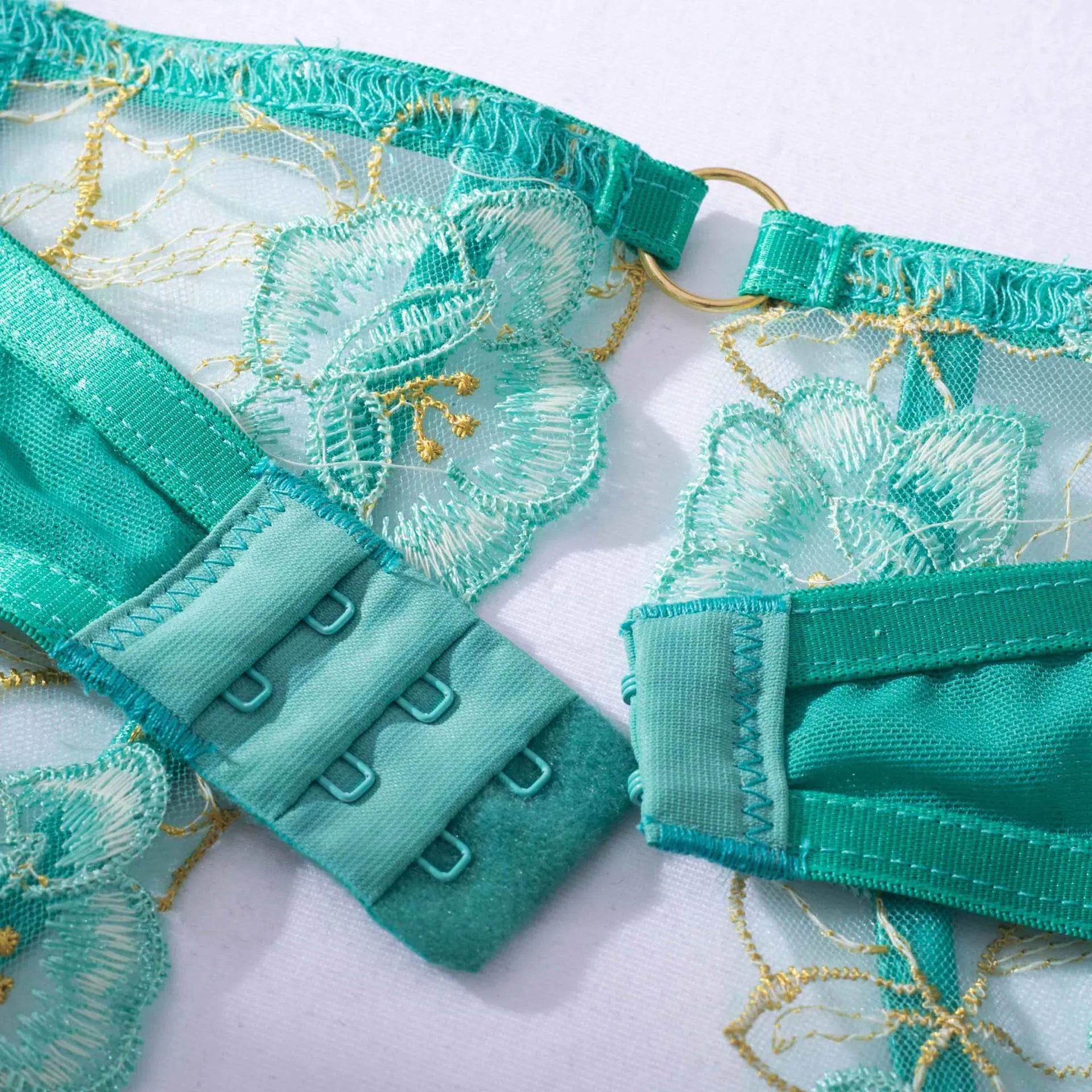 Light green women's bra set with embroidery detail and matching bikini bottoms