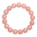 Pink crystal barrel bead bracelet with 8x10mm geometry-shaped stones on wrist