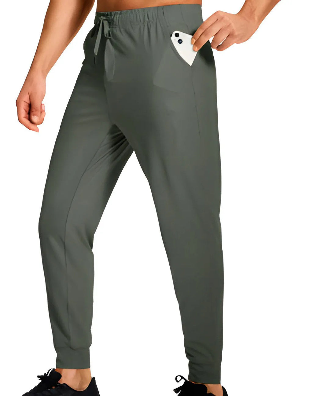 Man wearing loose-fit solid colour casual trousers made from polyester fabric.