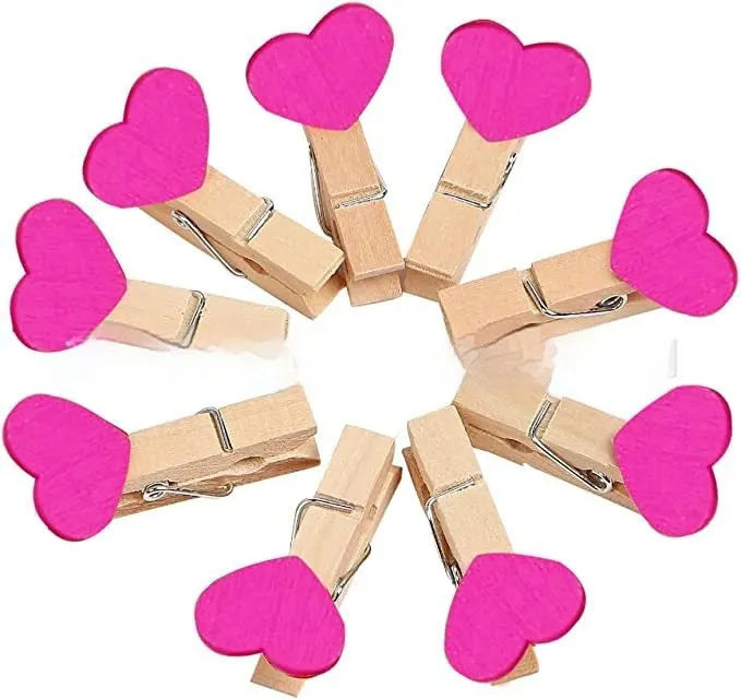 Set of five handmade solid wood heart-shaped clips in red, pink, white, yellow, and rose colours.