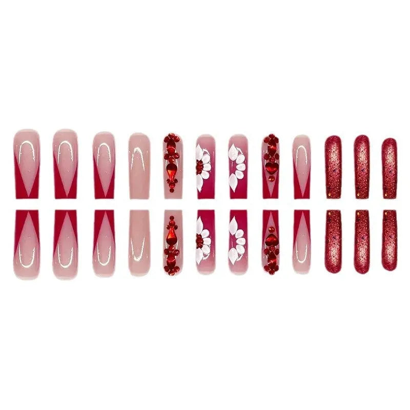 Artificial nails with floral pattern and red diamond accents in European square shape
