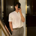 Men's black slim-fit short-sleeved ice silk knitted shirt laid flat, showing pullover style and thin fabric texture