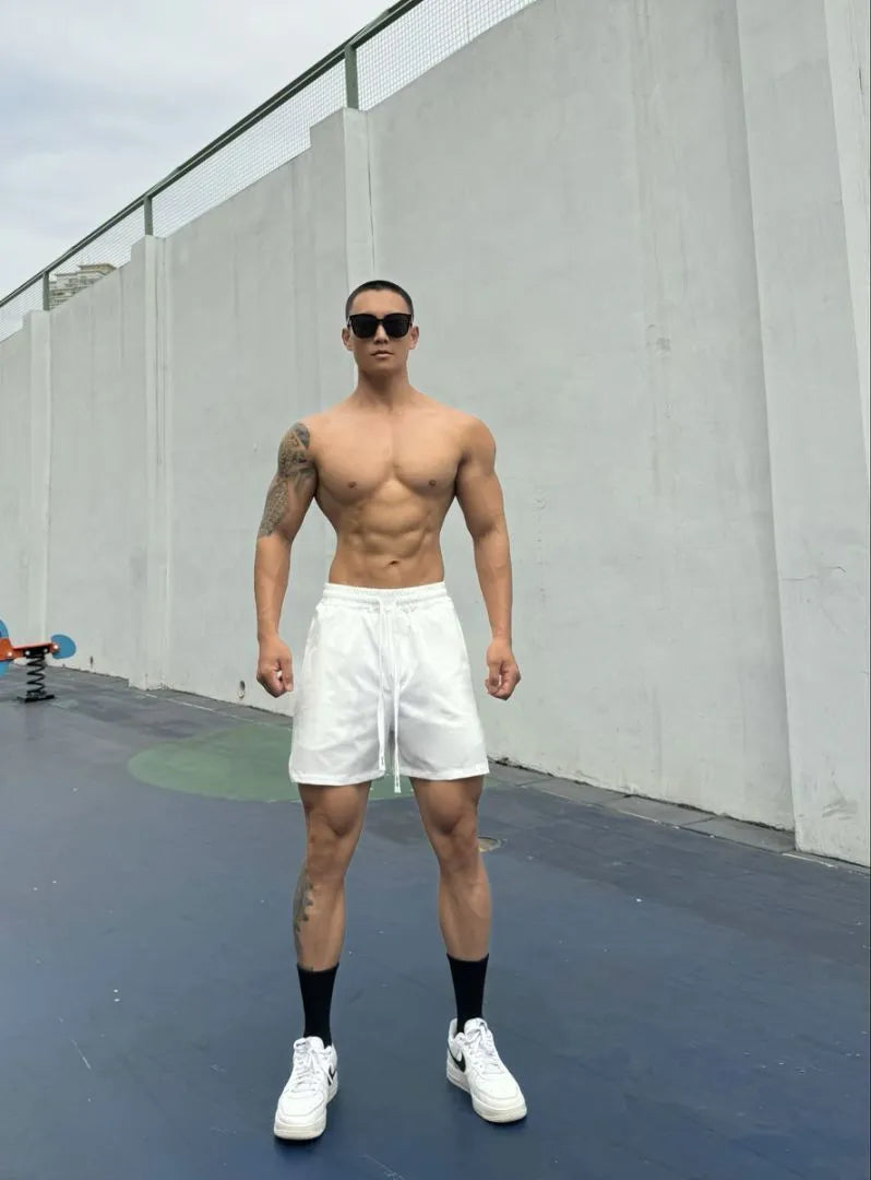 Men's ice silk quick-drying shorts in a quarter-length, casual style on a neutral background.