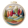 Embroidery DIY kit with landscape designs on cotton fabric, bamboo frame, thread, and needles