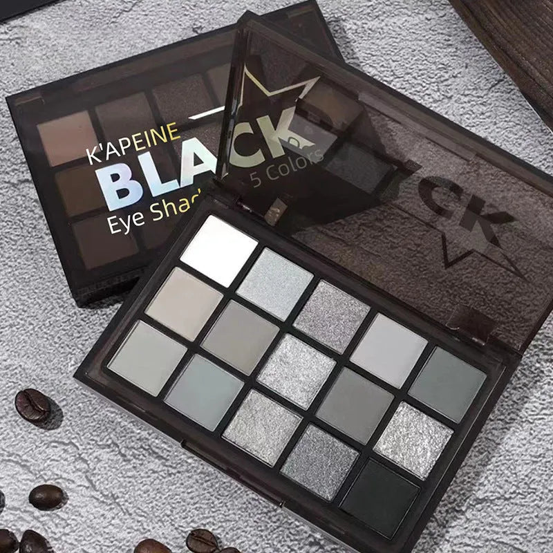 15-colour eyeshadow palette showing grey, black, brown and blue matte and shimmer shades