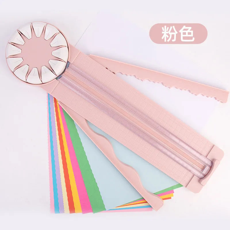 Pink and black 12-in-1 multifunctional plastic paper cutting machine for crafts.