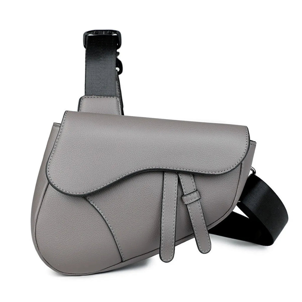 Unisex saddle shoulder crossbody chest bag in black synthetic leather with stitching and splicing details
