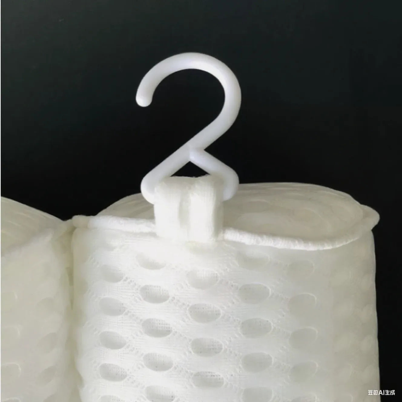 White bathtub pillow with suction cups on a 4D mesh surface.