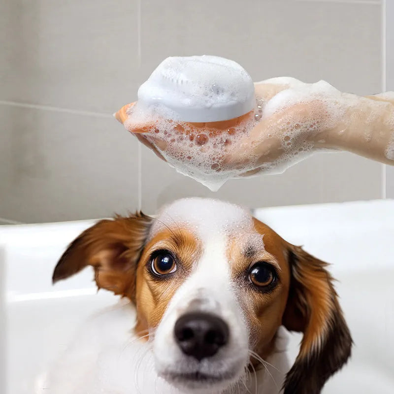 Orange TPR dog bath brush with shampoo dispenser and massage bristles