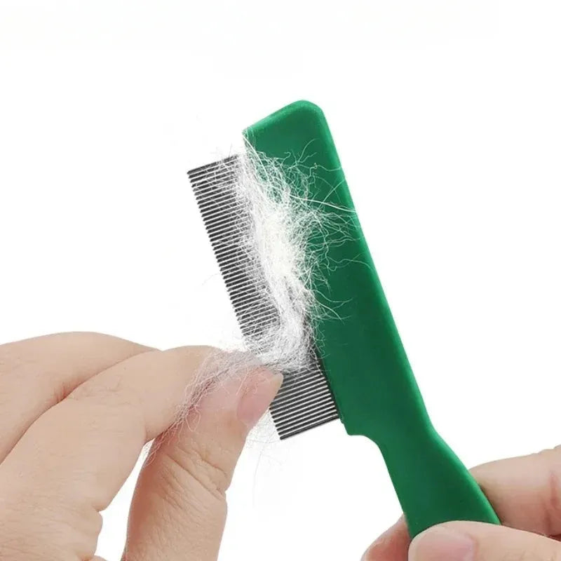 Green plastic-handled pet flea comb with stainless steel pins for dogs and cats.