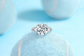 5-carat moissanite wedding ring in S925 silver with gold plating on white background