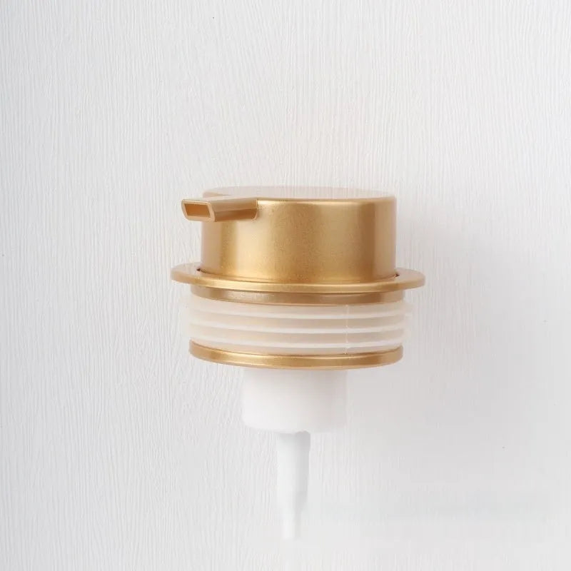 ABS plastic facial cleanser foam pump dispenser in gold finish