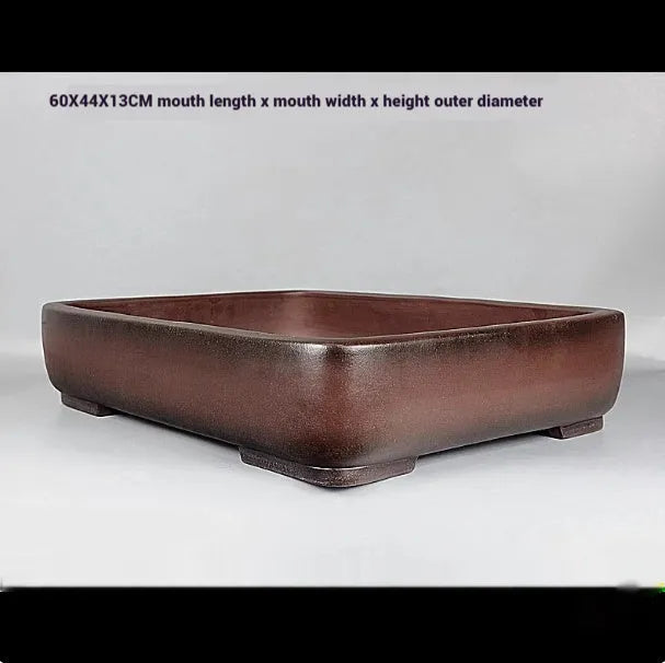 Handmade antique rectangular purple clay flower pot showing its size and natural colour.