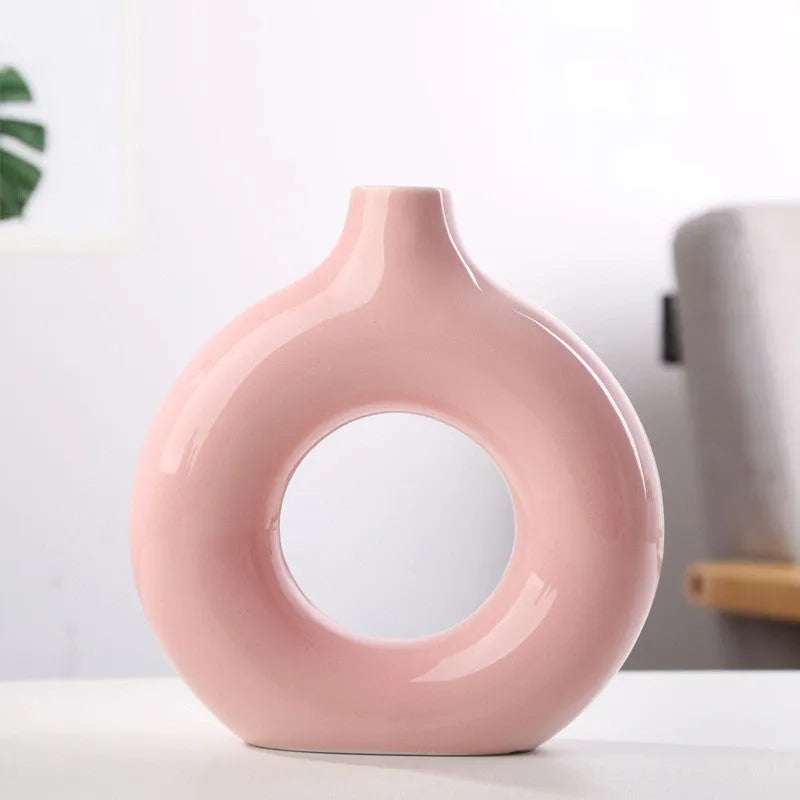 A simple modern frosted porcelain biscuit vase for flower arranging, shown in a neutral colour.