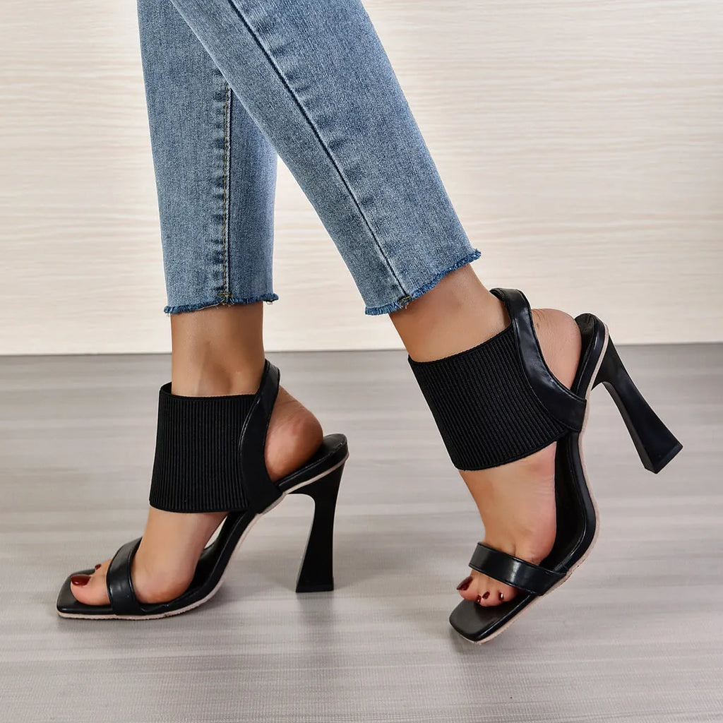 Women's high heel sandals with elastic straps in black, milky white, and brown colours