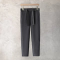 Boys slim straight wool blend trousers in neutral colours with tapered leg design