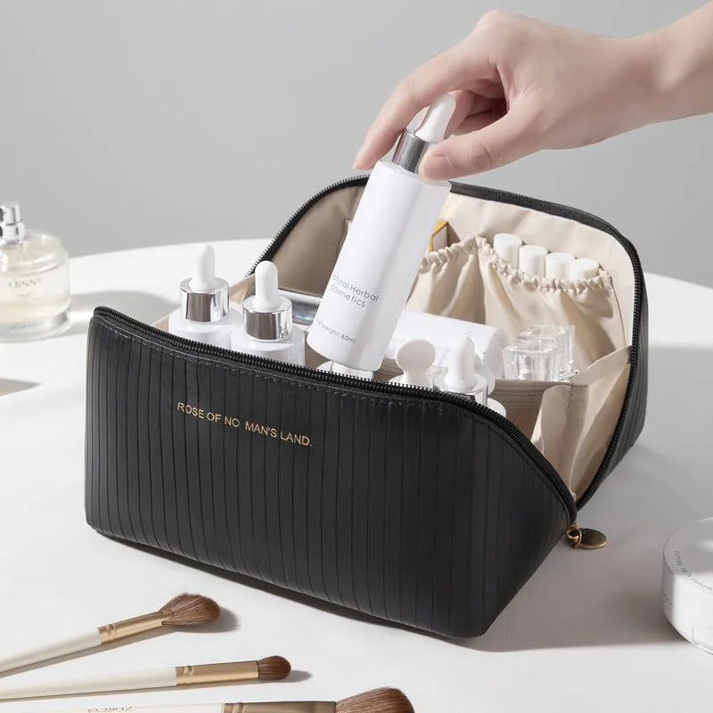Large beige cubic PU leather makeup bag with vertical pattern, shown open.