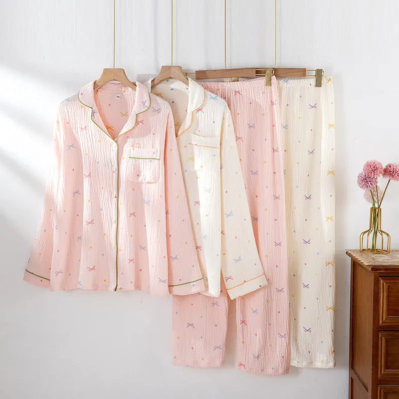 Women's cotton pajamas set in pink and beige colours showing long sleeves and trousers-length pants