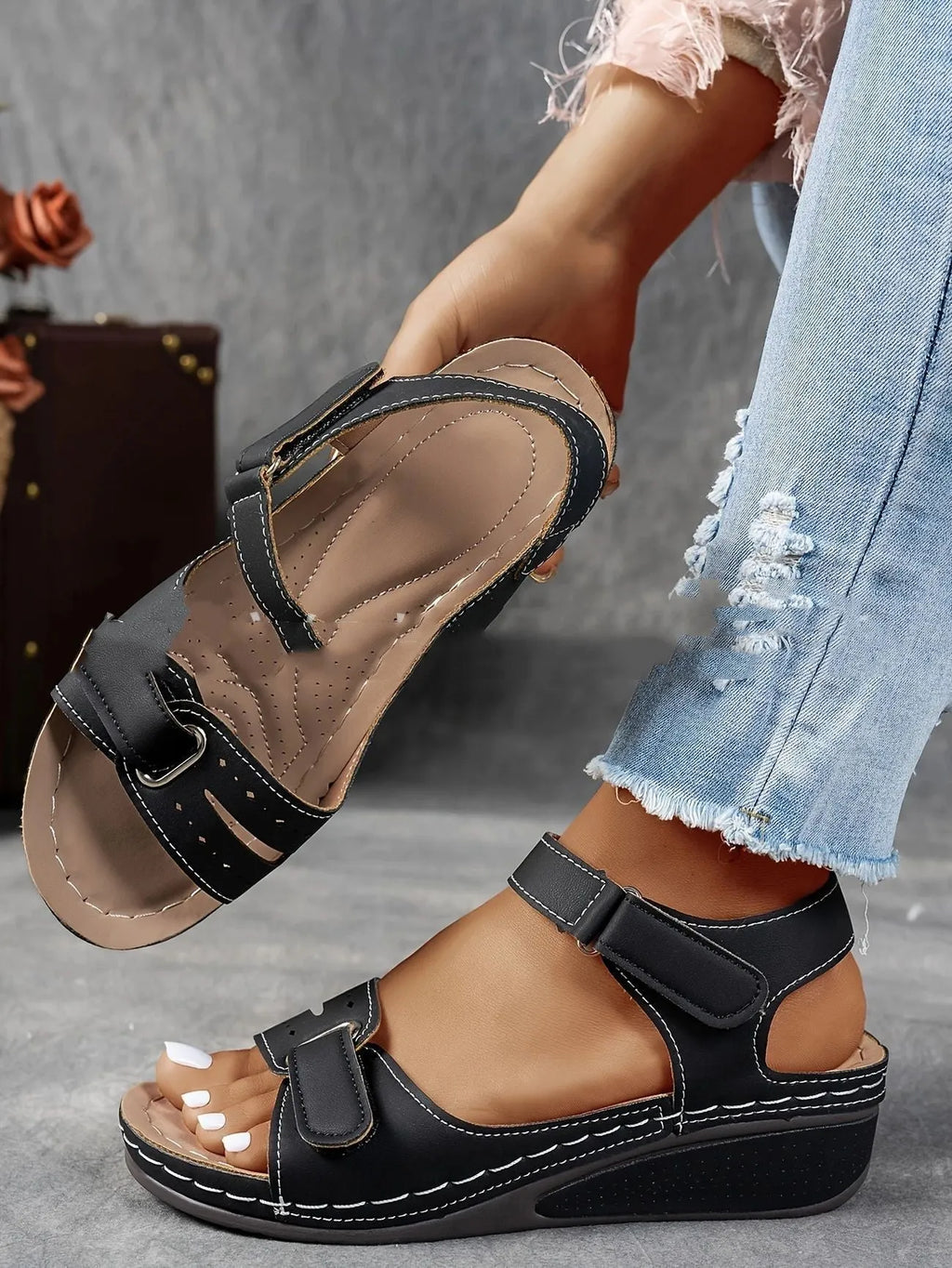 Women's beige thick-bottom strap sandals showing the Velcro fastener and round toe design.