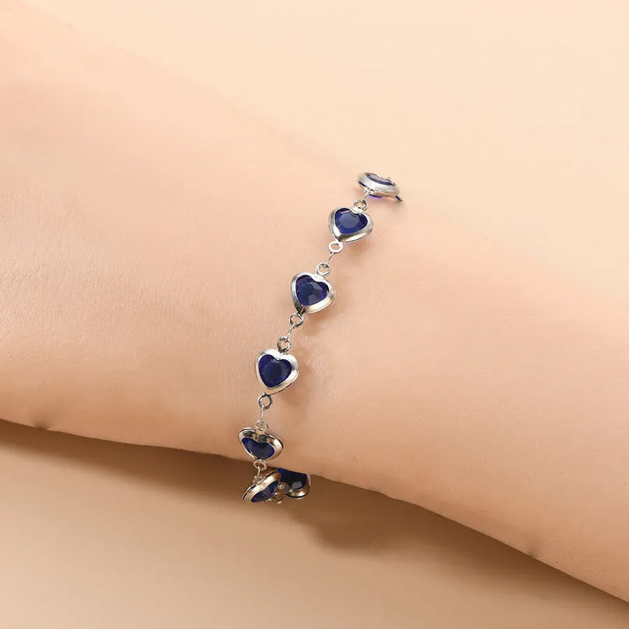 Geometric stainless steel bracelet with electroplated colourful finish showing round and oval design elements