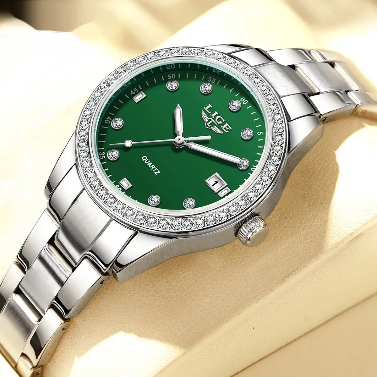 Fashion quartz watch with diamond-encrusted stainless steel case and silver-blue dial.