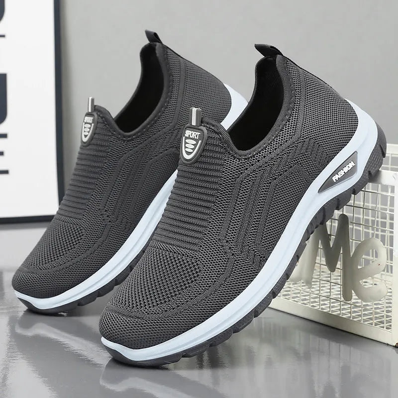 Men's black and grey breathable casual shoes with mesh lining, round toe, and PVC sole.