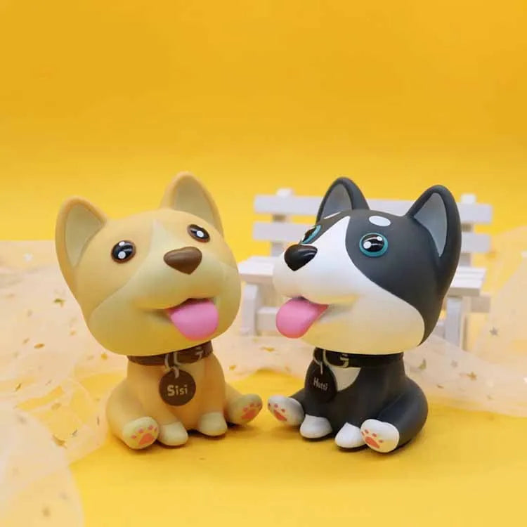 PVC nodding dog bobblehead in khaki, 9.3 cm tall, on a car dashboard