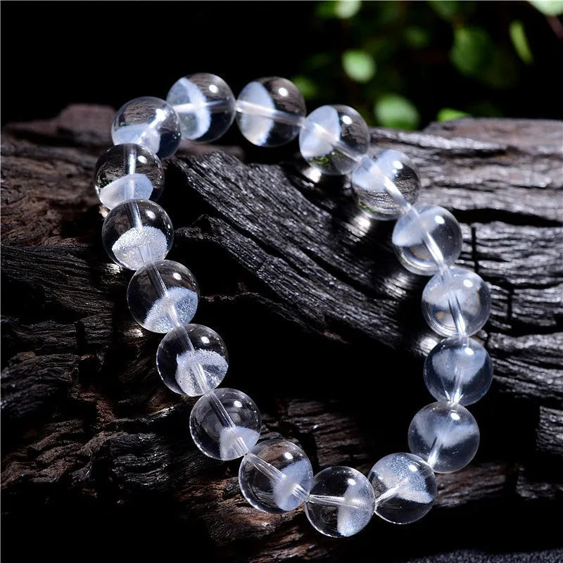 Women's white crystal pyramid bracelet with Ruyi charm showing natural ghost pyramid design