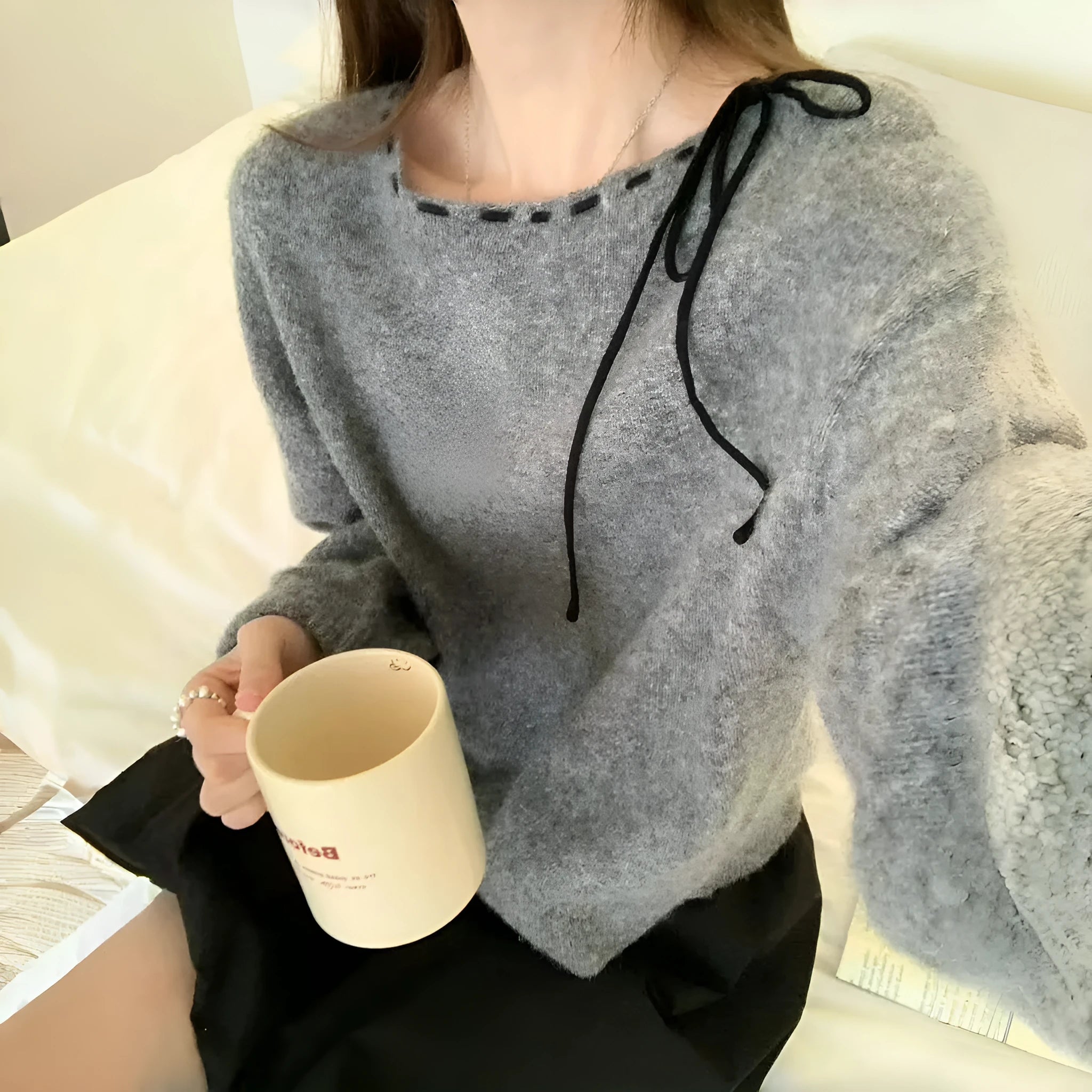 Grey loose-fitting women's pullover jumper made from regenerated cellulose fibre.