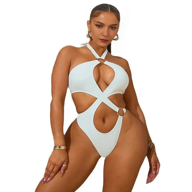 Women's white sleeveless jumpsuit with back lace-up detail and tapered shorts.