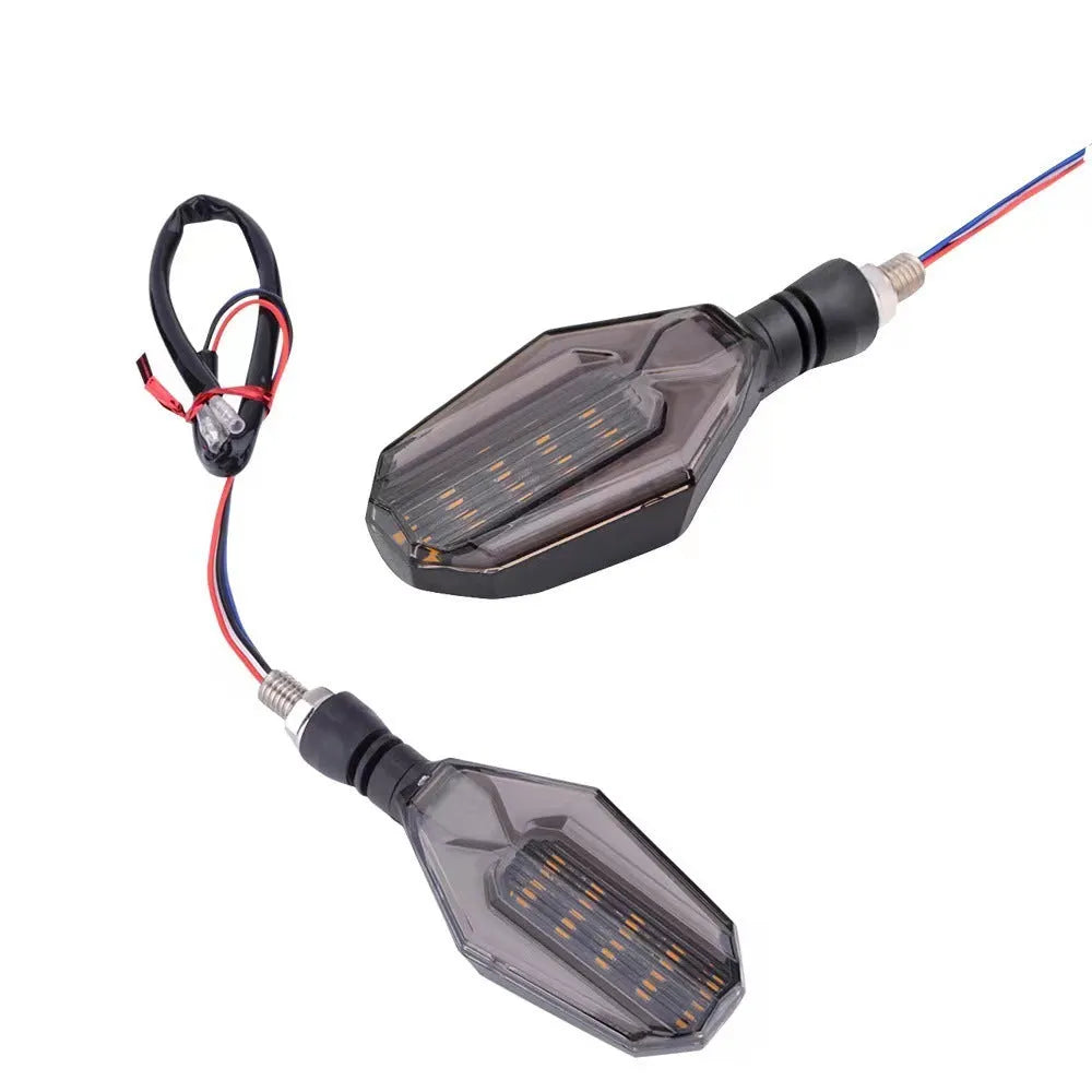 Pair of motorcycle indicator lights with coloured light guides on a black ABS acrylic housing.