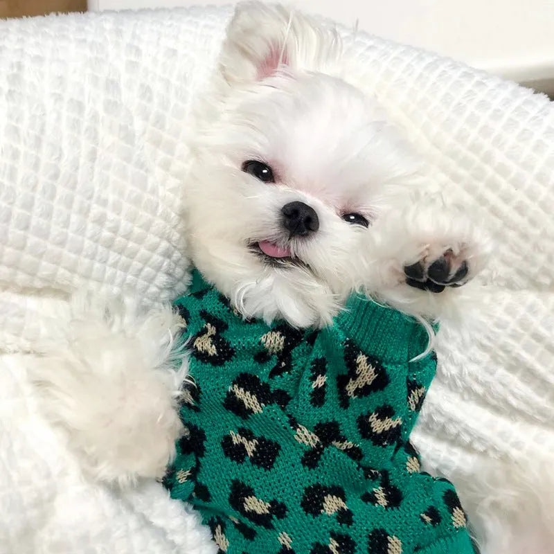 Green leopard print sleeveless knitted sweater for small dog or cat laying down