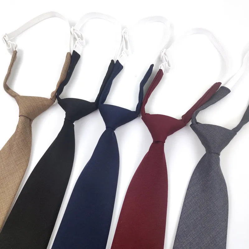 Men's arrow-style cotton bow tie in navy blue with tie-dye texture, laid flat showing its 35cm length.