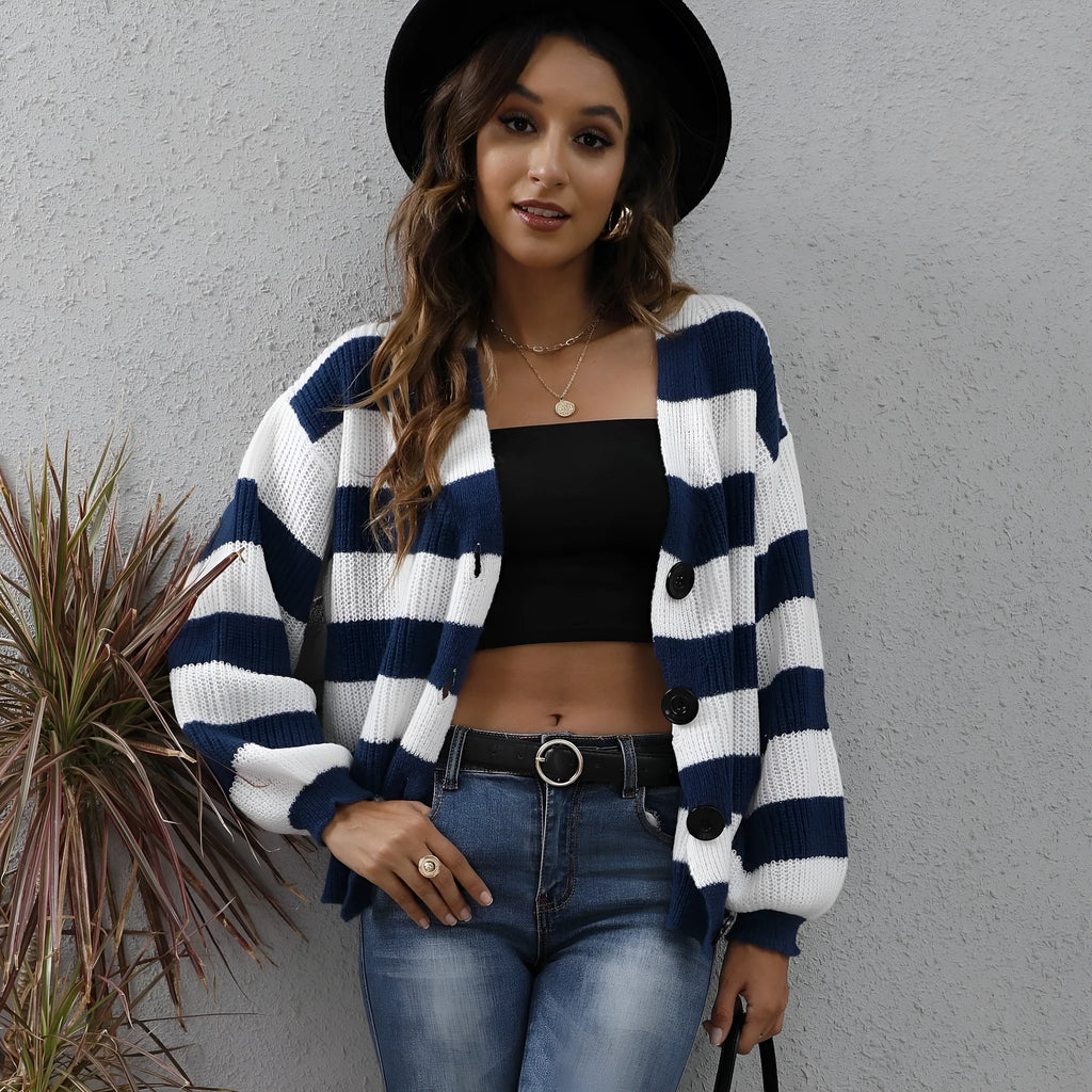 Blue striped women's cardigan sweater with buttons, shown on a hanger.