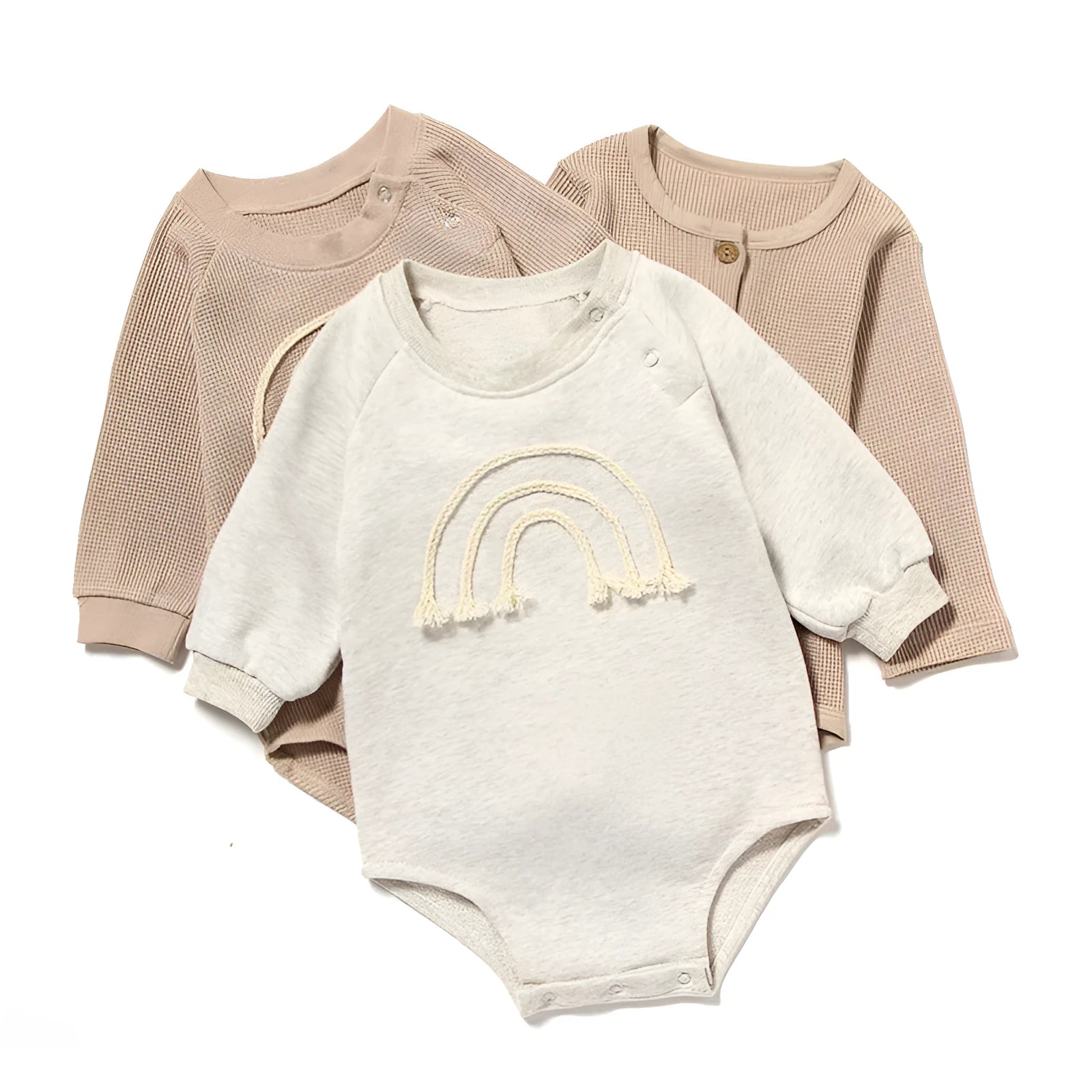 Infant wearing a beige waffle cotton long sleeve romper climbing suit