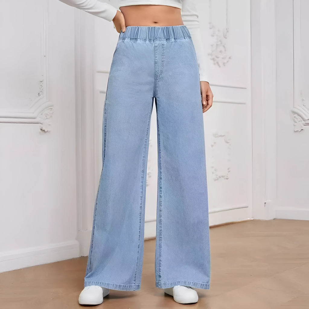 Light blue washed plus size women's wide-leg denim jeans with straight cut and zip fly