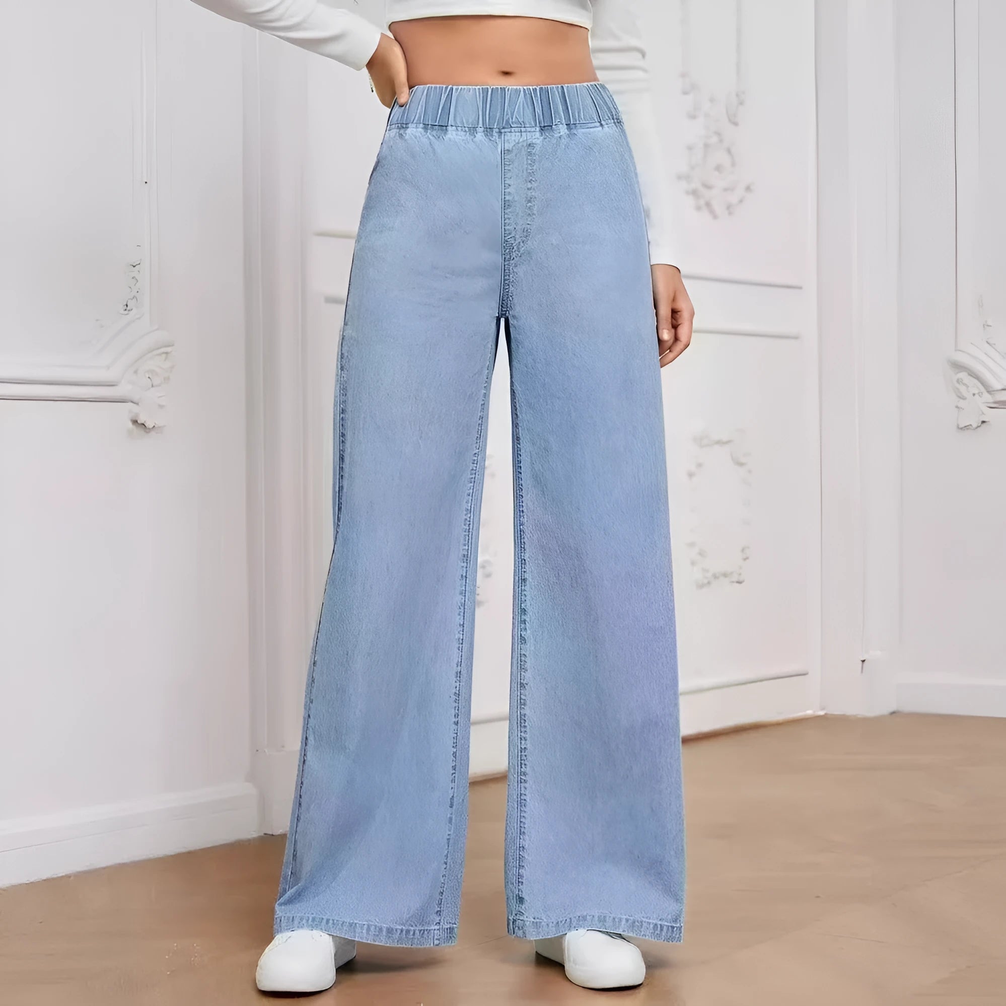 Light blue washed plus size women's wide-leg denim jeans with straight cut and zip fly